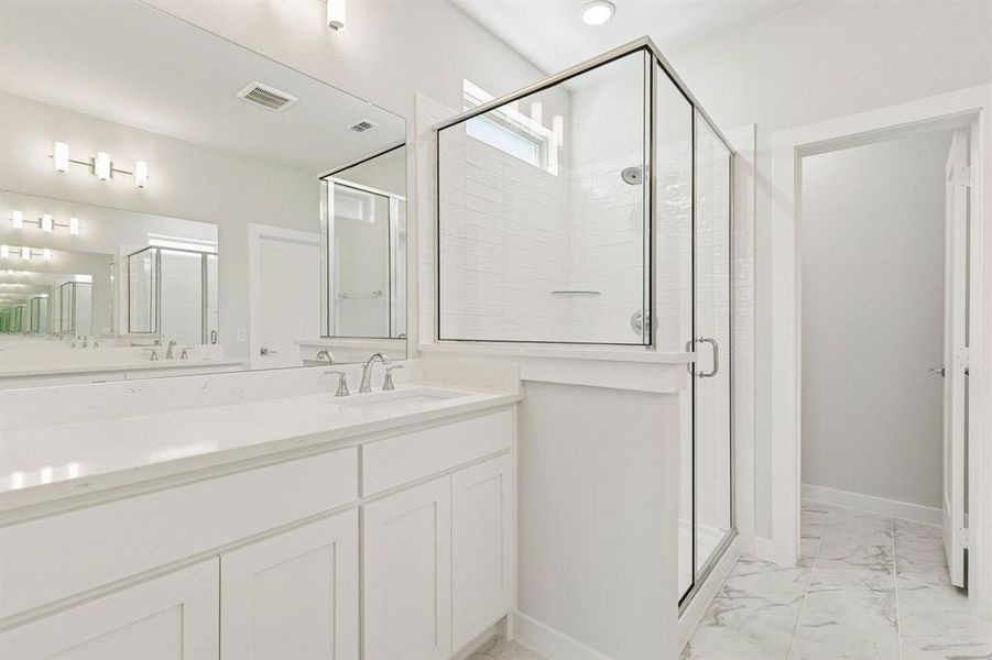 Primary Bathroom in the Masters home plan by Trophy Signature Homes – REPRESENTATIVE PHOTO Primary Bathroom in the Masters home plan by Trophy Signature Homes – REPRESENTATIVE PHOTO