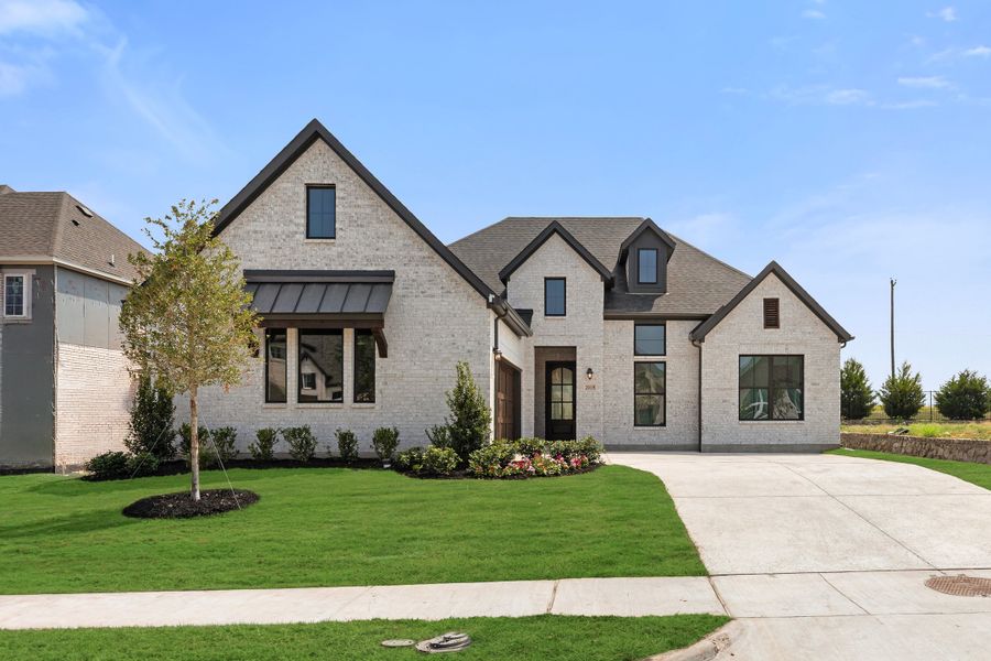 Front exterior of a new home in Nelson Lake Estates, Rockwall, TX, highlighting curb appeal (Image 2).