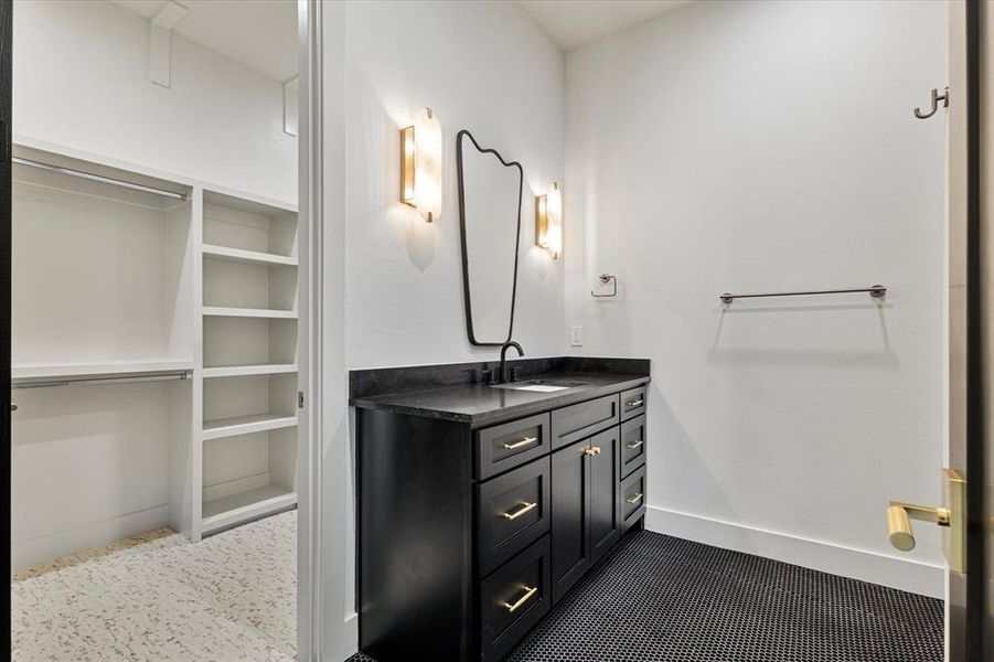 Bathroom with vanity and baseboards