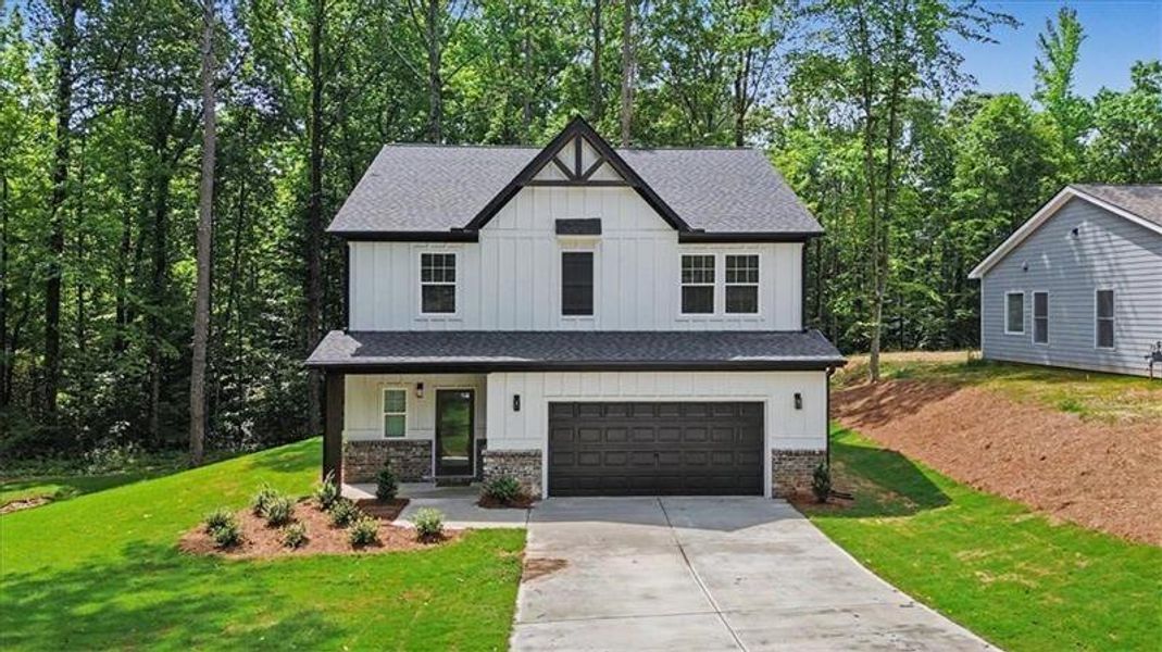 Front exterior of a new home in , Canton, GA, highlighting curb appeal (Image 1). Front exterior of a new home in , Canton, GA, highlighting curb appeal (Image 1).