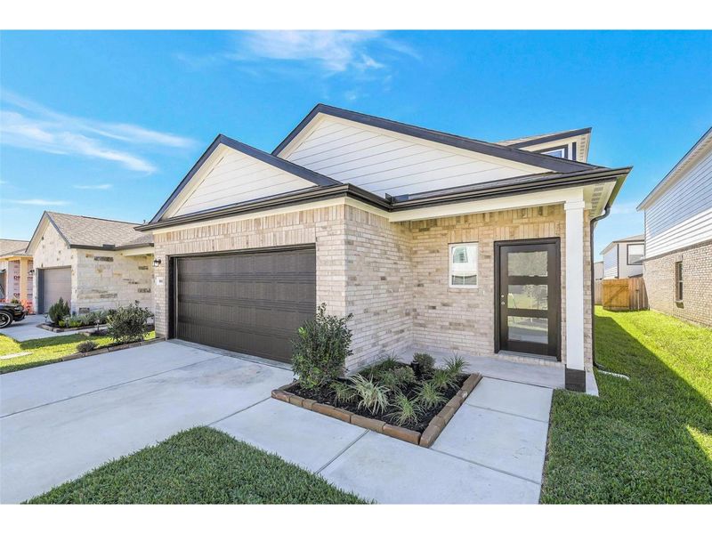 Exterior details and patio area of a home in Lakes at Black Oak, Magnolia (Image 2). Exterior details and patio area of a home in Lakes at Black Oak, Magnolia (Image 2).