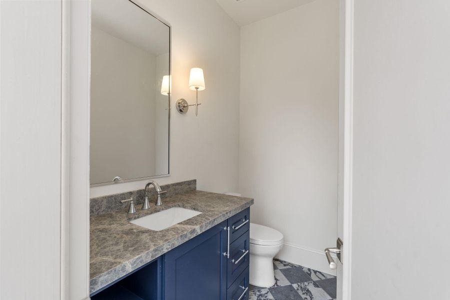 The half bath off the pool in the backyard is perfect for guests to enjoy while at the pool