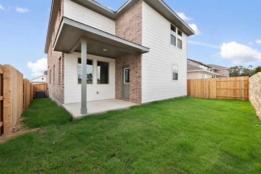 Exterior details and patio area of a home in Lariat, Liberty Hill (Image 4).