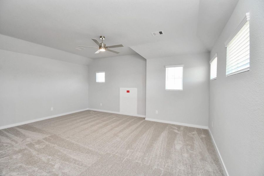 Ascend to relaxation in this fantastic game room! Ideal for both casual gatherings and adult gaming, it boasts plush carpet, lofty ceilings, custom paint, and ample windows for abundant natural light. Sample photo of completed home with similar floor plan. Actual colors and selections may vary. Ascend to relaxation in this fantastic game room! Ideal for both casual gatherings and adult gaming, it boasts plush carpet, lofty ceilings, custom paint, and ample windows for abundant natural light. Sample photo of completed home with similar floor plan. Actual colors and selections may vary.