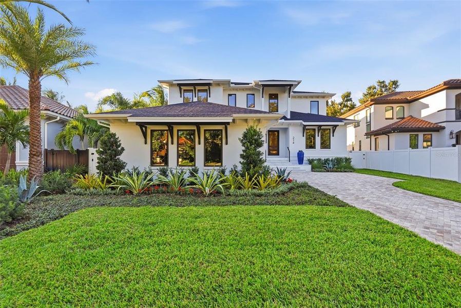 Front exterior of a new home in , St. Petersburg, FL, highlighting curb appeal (Image 2). Front exterior of a new home in , St. Petersburg, FL, highlighting curb appeal (Image 2).