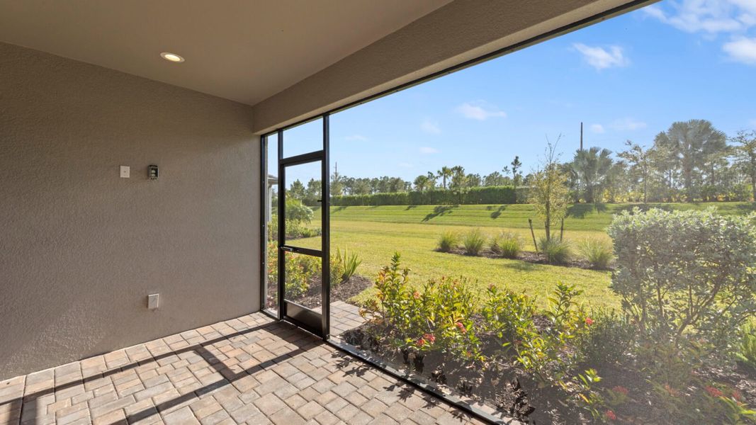 Exterior details and patio area of a home in SkySail, Naples (Image 18).