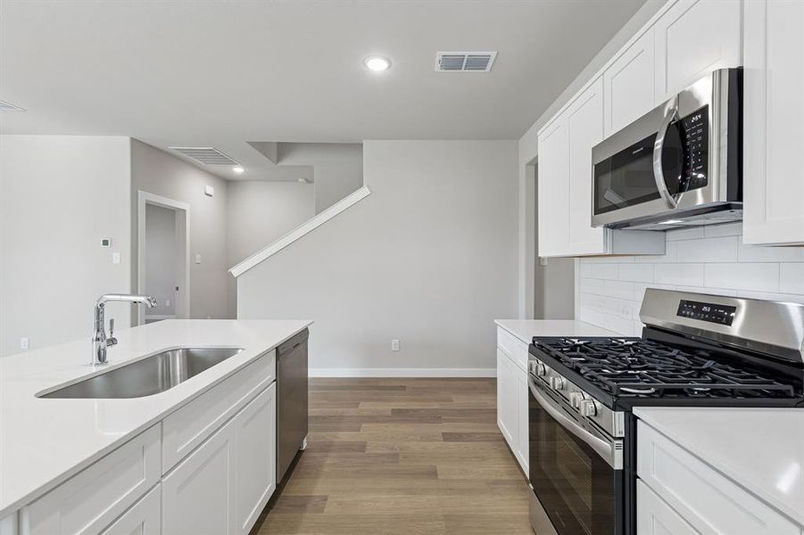 Kitchen in the Holden home plan by Trophy Signature Homes – REPRESENTATIVE PHOTO Kitchen in the Holden home plan by Trophy Signature Homes – REPRESENTATIVE PHOTO