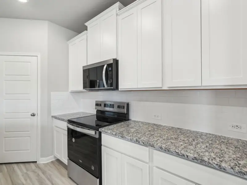Kitchen in the Briscoe floorplan at a Meritage Homes community. Kitchen in the Briscoe floorplan at a Meritage Homes community.