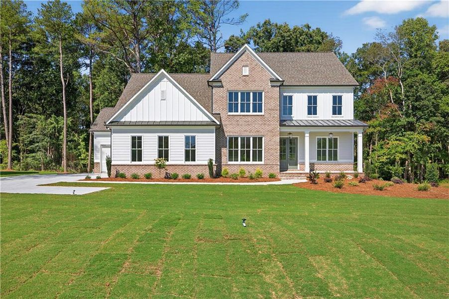 Front exterior of a new home in , Cumming, GA, highlighting curb appeal (Image 28).