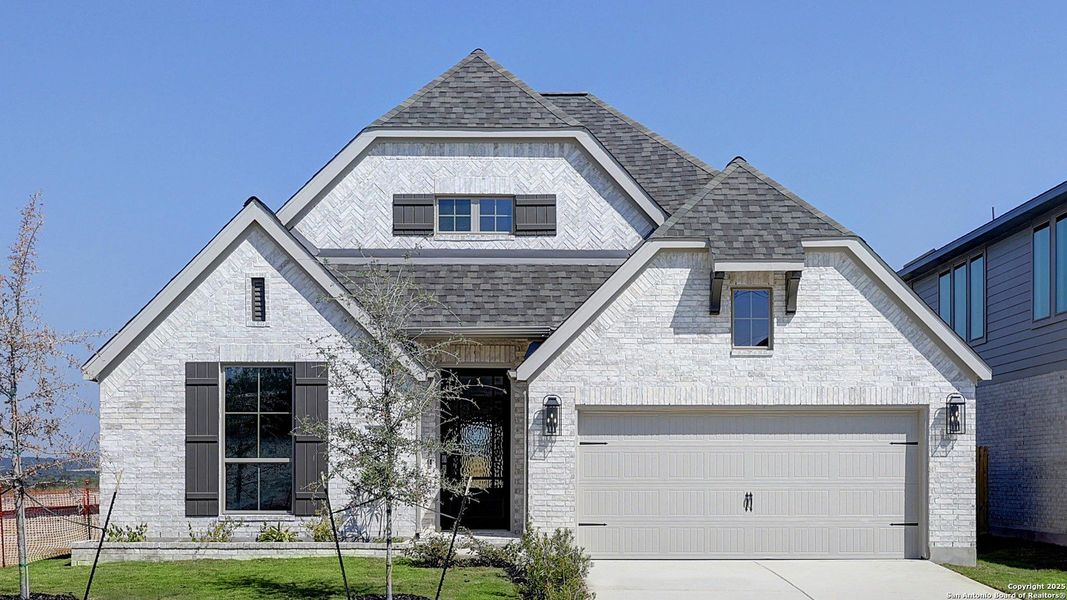 Front exterior of a new home in Arcadia Ridge 50', San Antonio, TX, highlighting curb appeal (Image 1). Front exterior of a new home in Arcadia Ridge 50', San Antonio, TX, highlighting curb appeal (Image 1).