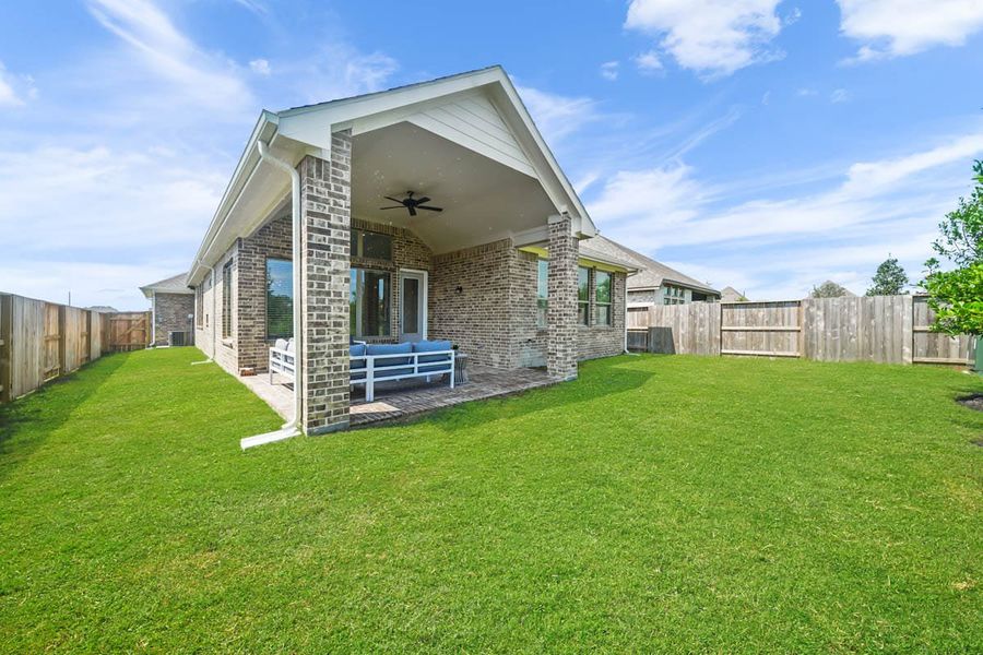 Exterior details and patio area of a home in The Trails, New Caney (Image 4).