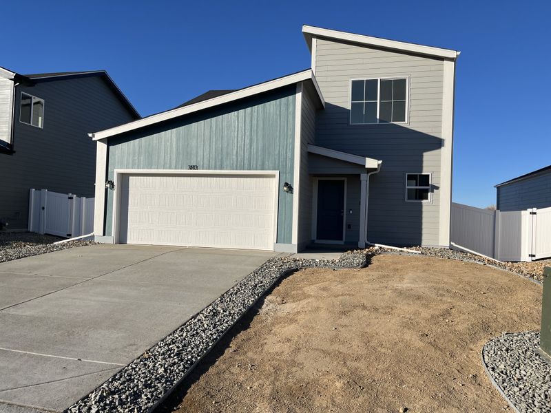 Front exterior of a new home in Liberty Draw, Evans, CO, highlighting curb appeal (Image 2). Front exterior of a new home in Liberty Draw, Evans, CO, highlighting curb appeal (Image 2).