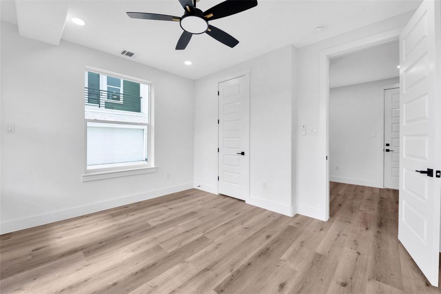 Another view of the first floor bedroom. The window in the room brings in ample natural light.