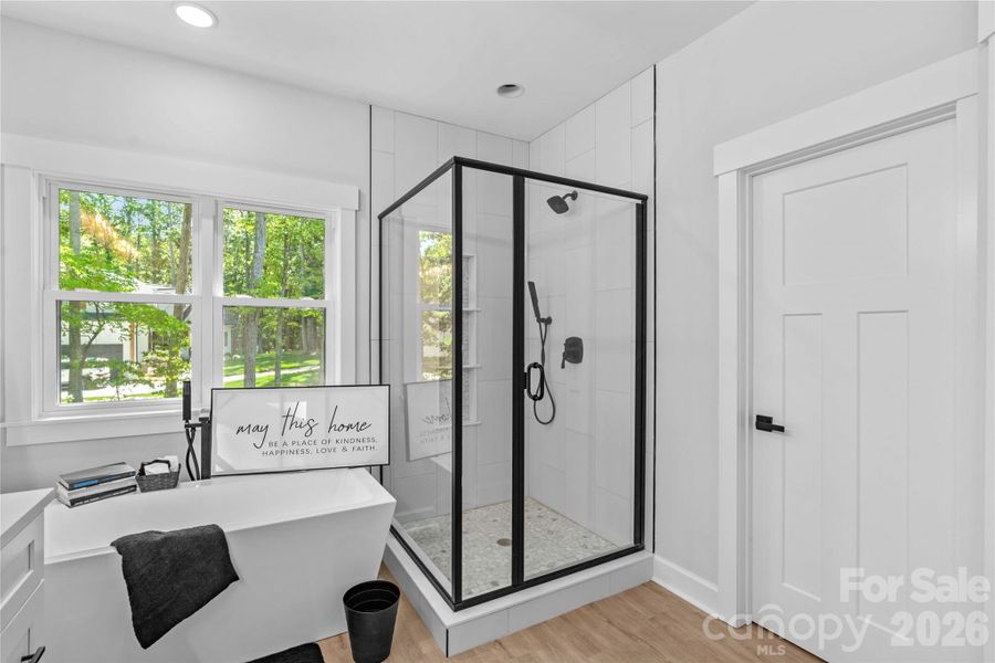Main Bath Roman soaking Tub & tiled Shower.