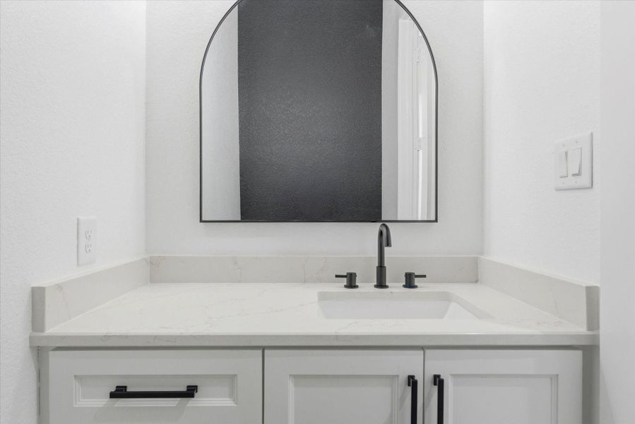 The first floor includes a thoughtfully placed powder bath for guest convenience.