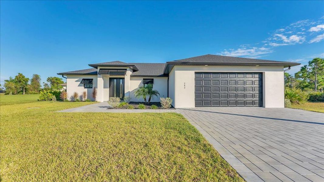 Front exterior of a new home in , Placida, FL, highlighting curb appeal (Image 2). Front exterior of a new home in , Placida, FL, highlighting curb appeal (Image 2).
