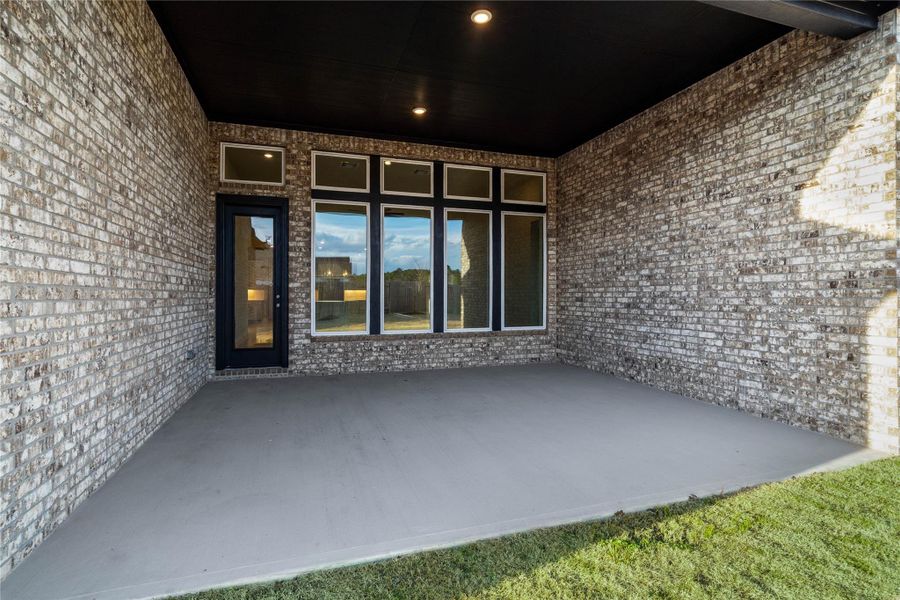 Step outside to the covered rear patio, the perfect extension of your indoor living space for year-round enjoyment.