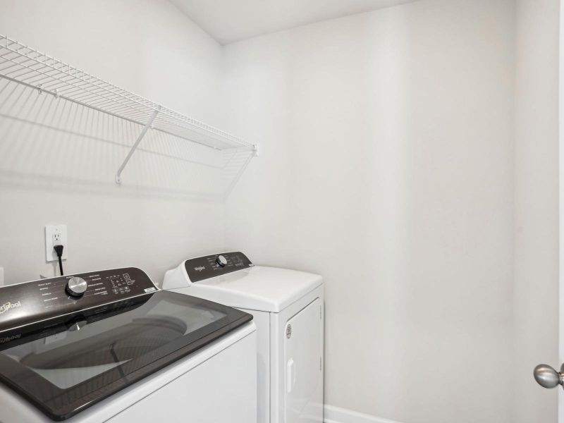 Enjoy laundry day with space to fold or sort clothes and organize essentials. Enjoy laundry day with space to fold or sort clothes and organize essentials.