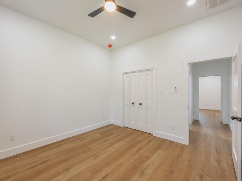 With large windows and recessed lighting, this secondary bedroom provides a peaceful atmosphere and plenty of space to personalize. With large windows and recessed lighting, this secondary bedroom provides a peaceful atmosphere and plenty of space to personalize.