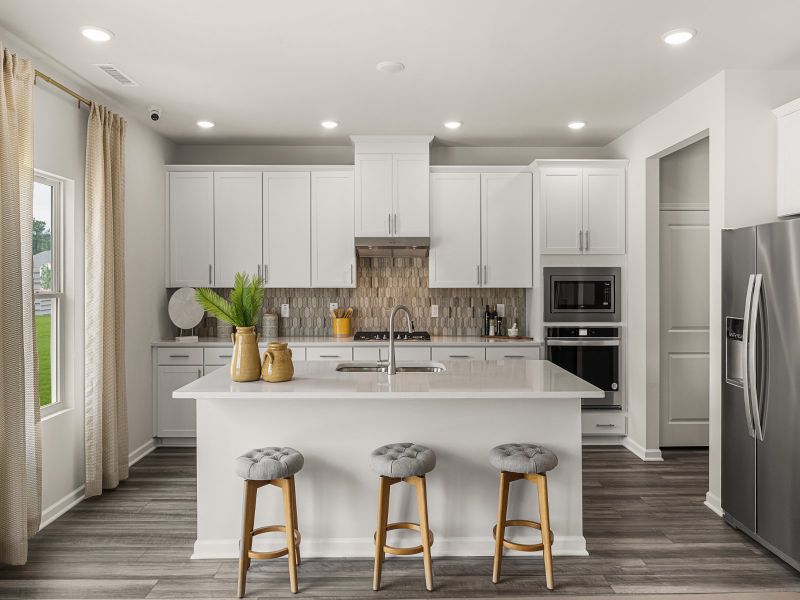 Kitchen in the Taylorsville floorplan at a Meritage Homes community in Wendell, NC.