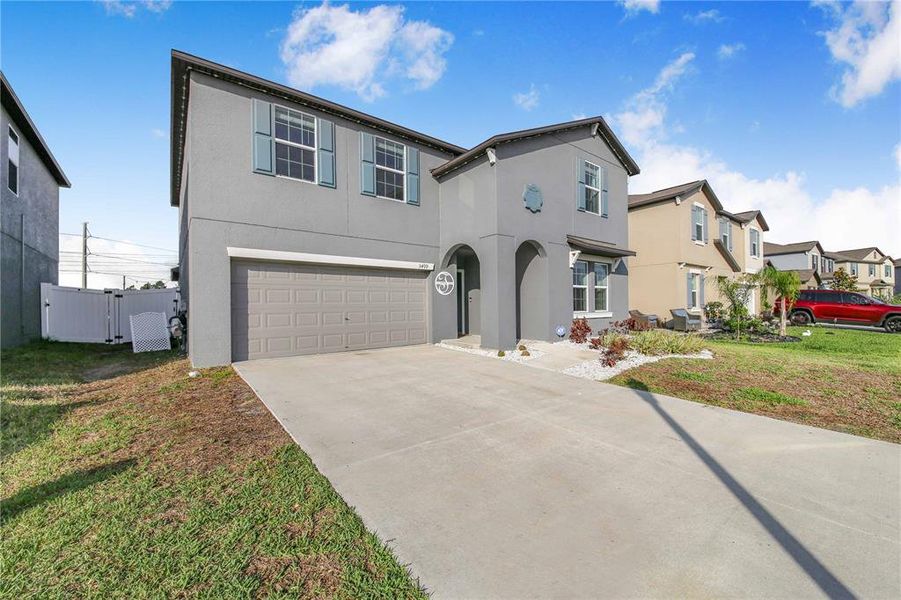 Front exterior of a new home in Wind Meadows South, Bartow, FL, highlighting curb appeal (Image 25).