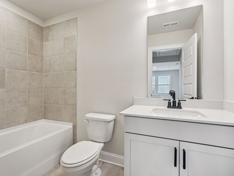 The Dallas Basement floorplan with the Modern Rustic Harbor interior package.