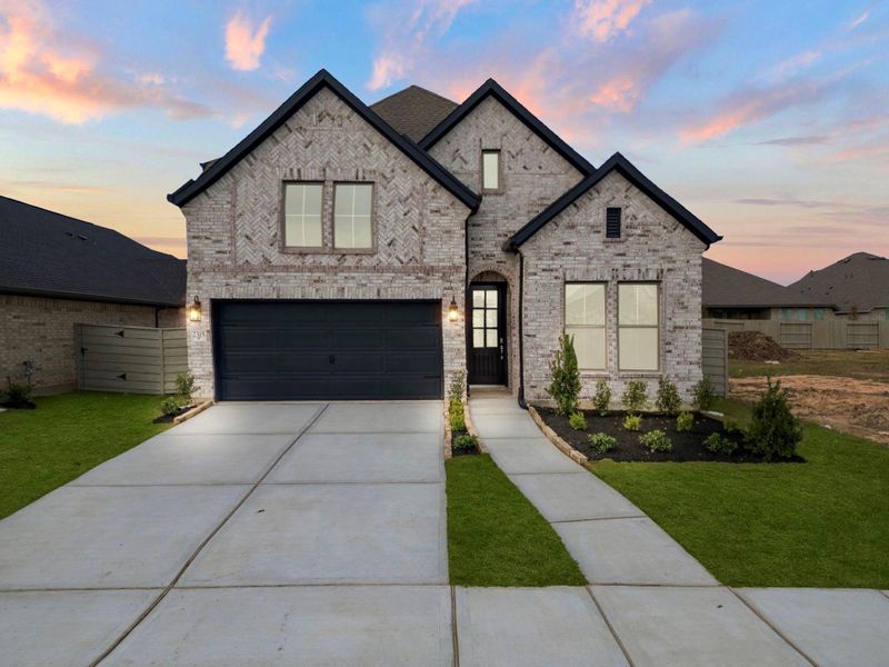 Front exterior of a new home in Pomona, Manvel, TX, highlighting curb appeal (Image 1). Front exterior of a new home in Pomona, Manvel, TX, highlighting curb appeal (Image 1).
