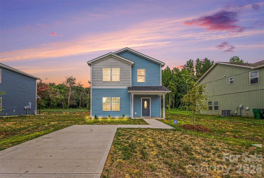 Front exterior of a new home in , Charlotte, NC, highlighting curb appeal (Image 16).