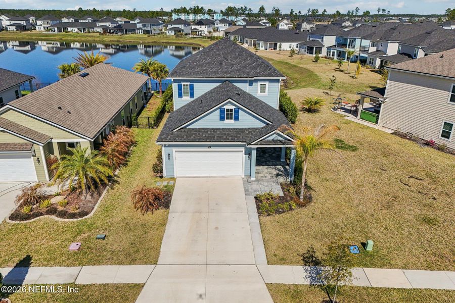 Front exterior of a new home in Beacon Lake, St. Augustine, FL, highlighting curb appeal (Image 24).