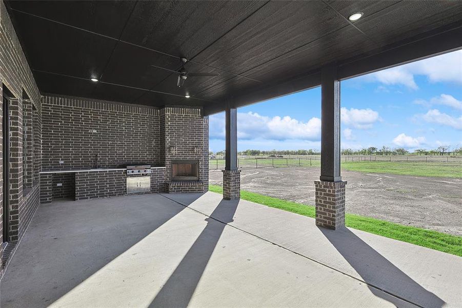 View of patio featuring area for grilling and a rural view