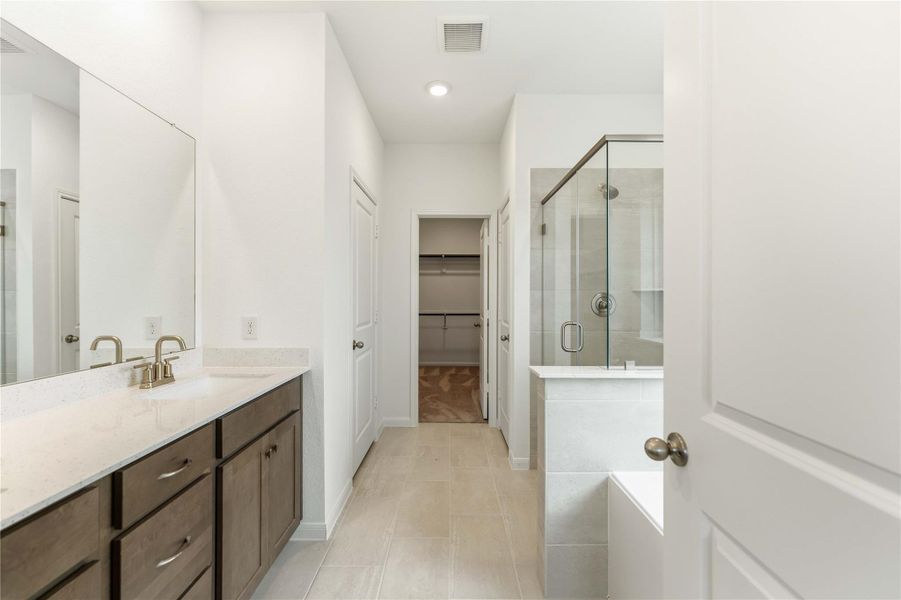 Furnished interior view inside a new home in Sunterra, Katy (Image 11).