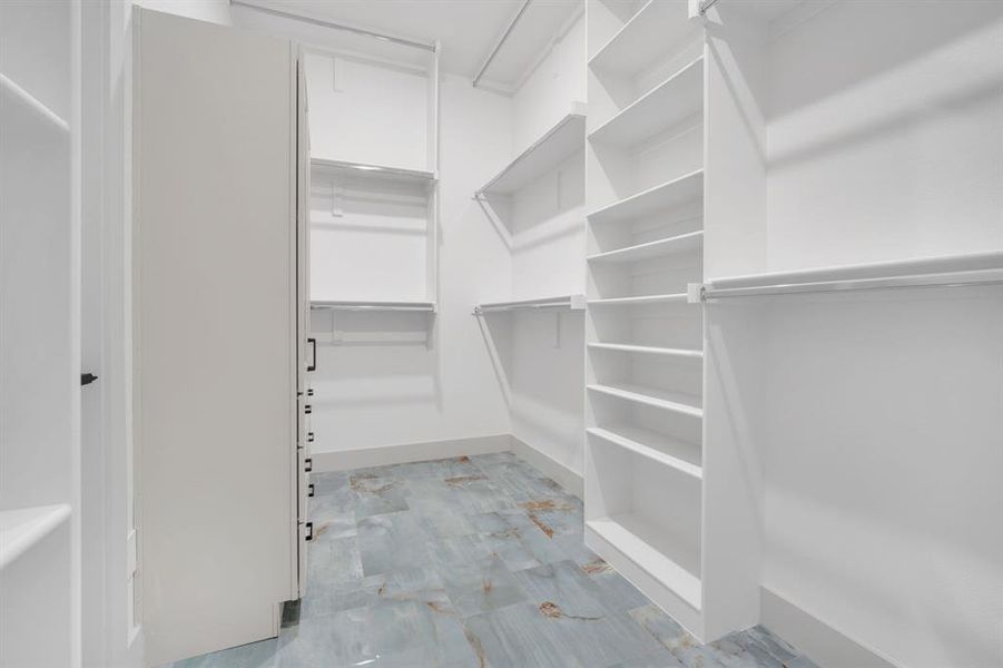 View of walk in closet View of walk in closet
