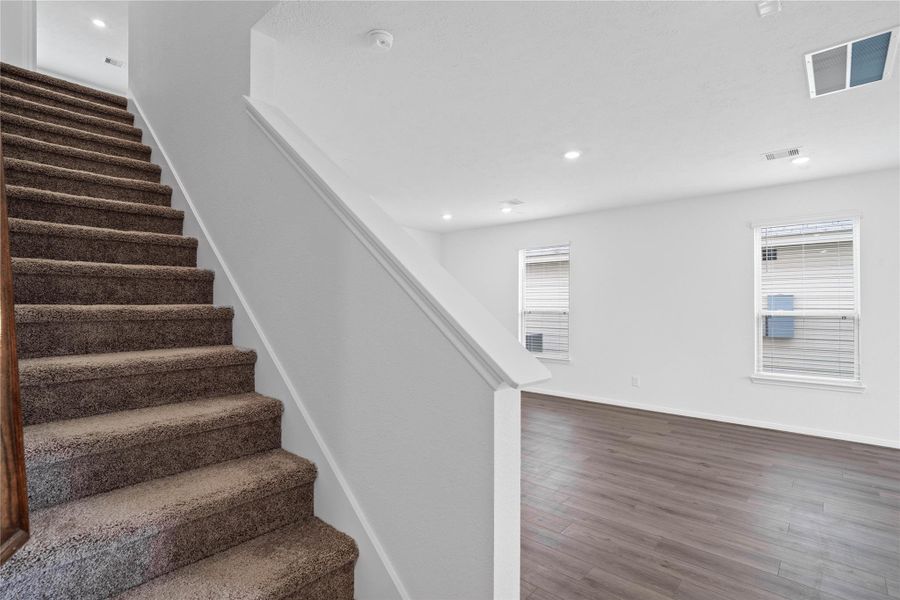 A beautifully carpeted staircase leads you to the second floor bedrooms and bathrooms! A beautifully carpeted staircase leads you to the second floor bedrooms and bathrooms!