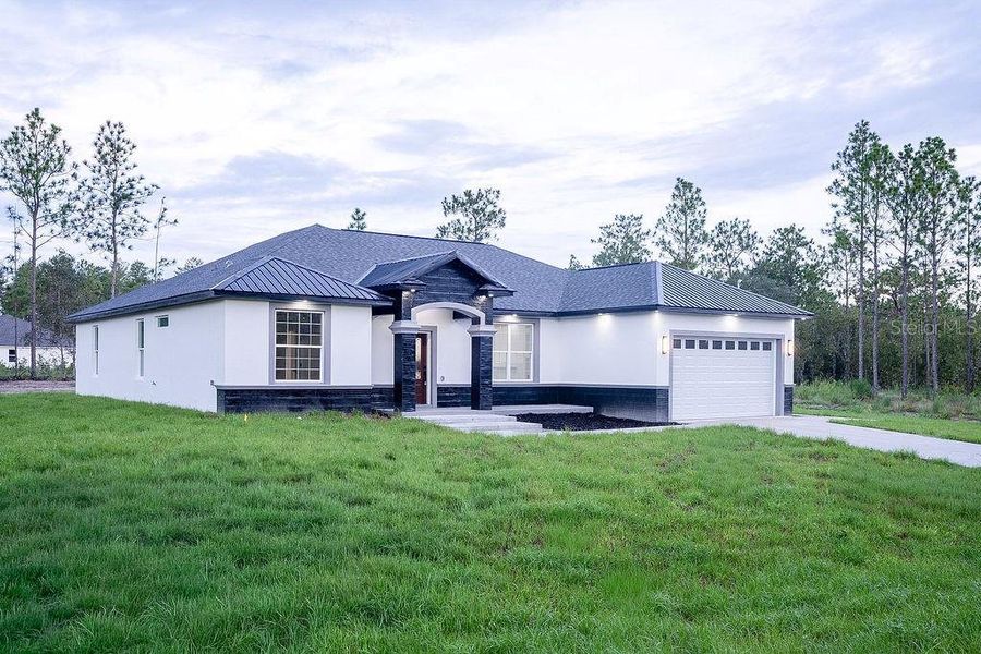 Front exterior of a new home in , Dunnellon, FL, highlighting curb appeal (Image 33). Front exterior of a new home in , Dunnellon, FL, highlighting curb appeal (Image 33).