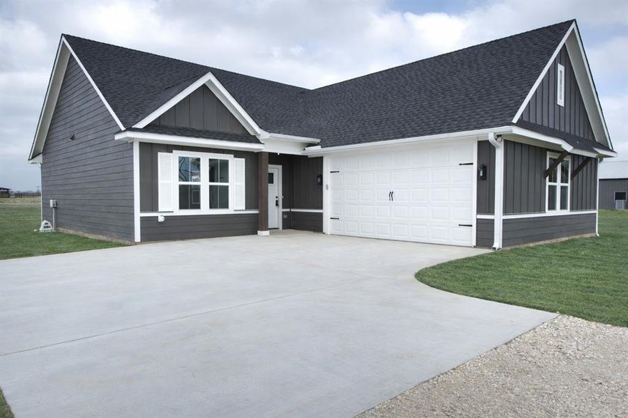 Front exterior of a new home in , Sadler, TX, highlighting curb appeal (Image 23).