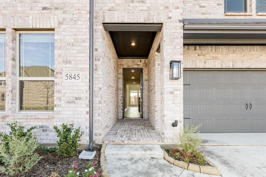 Exterior details and patio area of a home in Creekview Meadows, Pilot Point (Image 29).