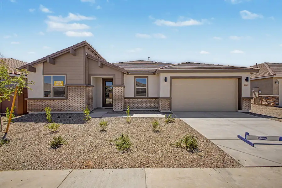 Front exterior of a new home in Miravida, Surprise, AZ, highlighting curb appeal (Image 1). Front exterior of a new home in Miravida, Surprise, AZ, highlighting curb appeal (Image 1).