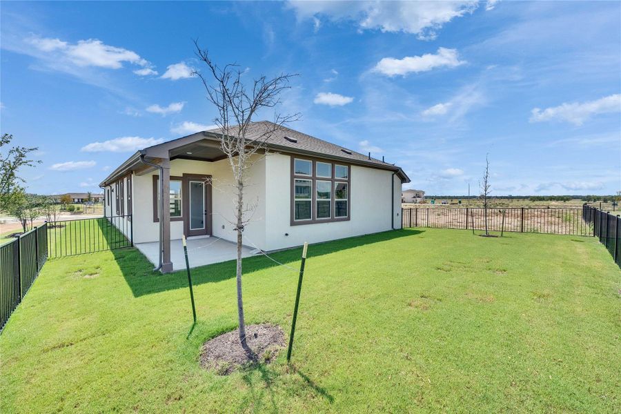 Back of property featuring a patio, a fenced backyard, and stucco siding Back of property featuring a patio, a fenced backyard, and stucco siding