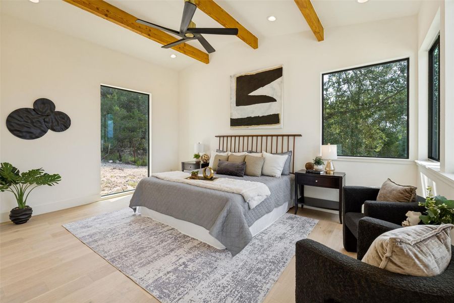 A spacious, glass-enclosed bathroom offers natural light and serene outdoor vistas.
