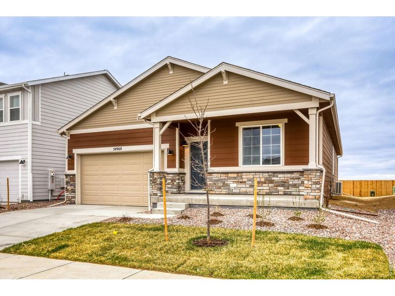 Front exterior of a new home in Farmstead, Berthoud, CO, highlighting curb appeal (Image 1). Front exterior of a new home in Farmstead, Berthoud, CO, highlighting curb appeal (Image 1).