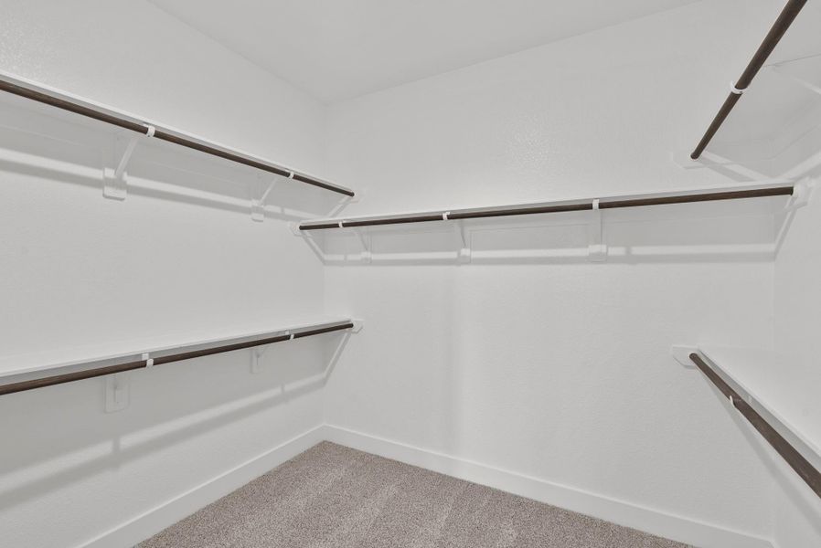 This closet is a perfect blank canvas to design a custom closet with ample hanging space, perfectly organized drawers, and chic shoe racks come together seamlessly, ensuring that everything has its place.