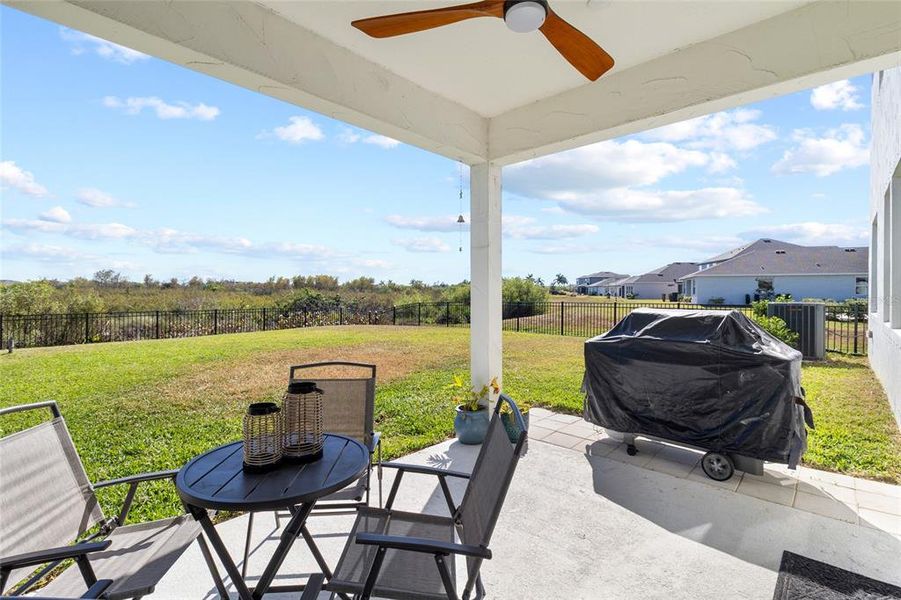Exterior details and patio area of a home in Isles at Bayview, Parrish (Image 26).