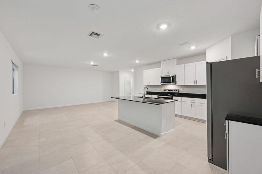 Furnished interior view inside a new home in Meritage Homes at Terra Lago - Premier Series, Indiantown (Image 7).