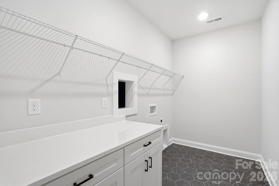 Laundry Room with pass through from Primary Laundry Room with pass through from Primary