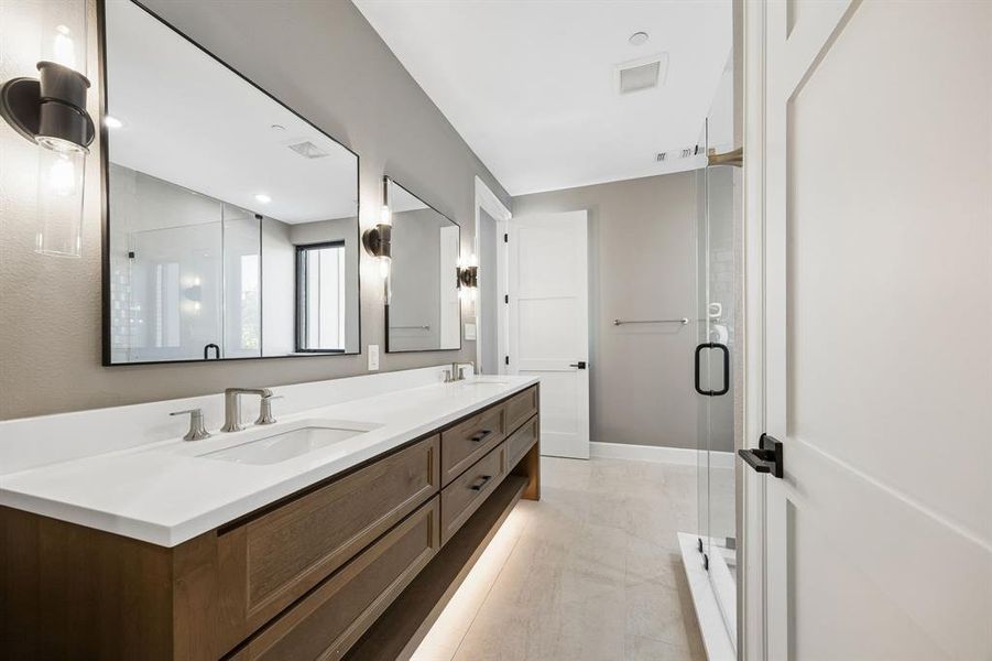 Full bath with double vanity and a stall shower Full bath with double vanity and a stall shower