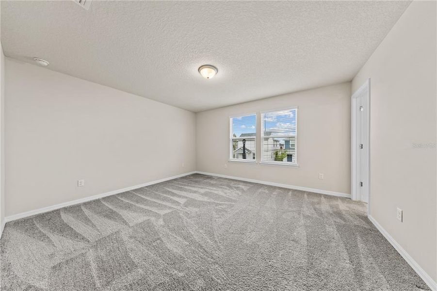 Spacious, unfurnished interior of a new home in EverBe, Orlando (Image 29).