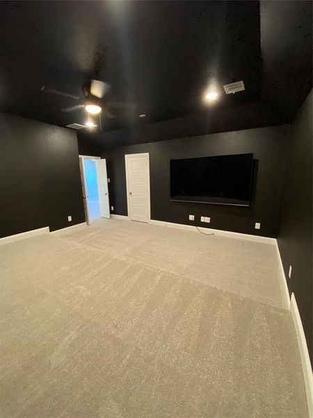 Spare room featuring carpet floors and ceiling fan Spare room featuring carpet floors and ceiling fan
