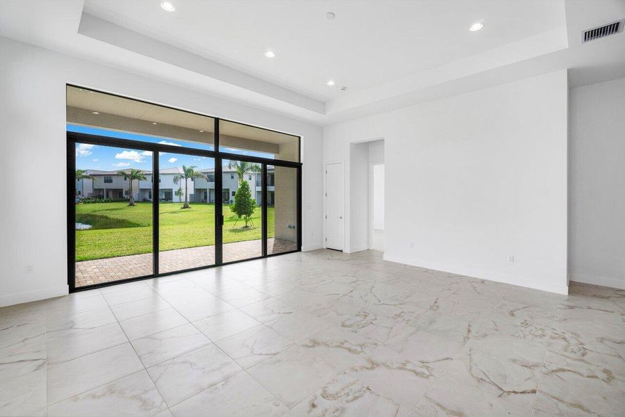 Front exterior of a new home in Lotus Edge, Boca Raton, FL, highlighting curb appeal (Image 12). Front exterior of a new home in Lotus Edge, Boca Raton, FL, highlighting curb appeal (Image 12).