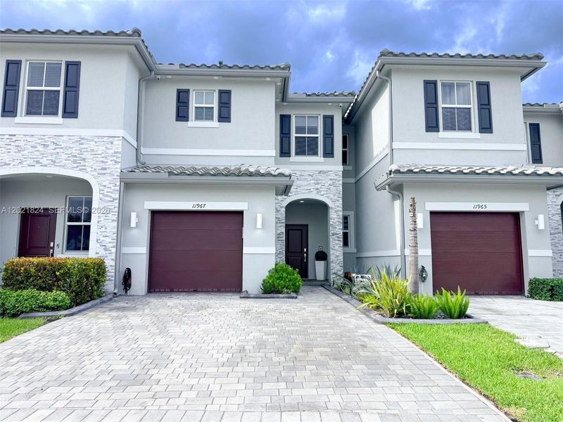 Front exterior of a new home in , Coral Springs, FL, highlighting curb appeal (Image 24).