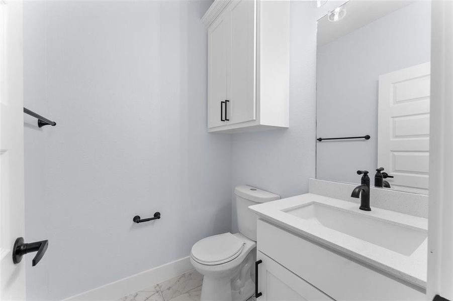 Bathroom with toilet and vanity